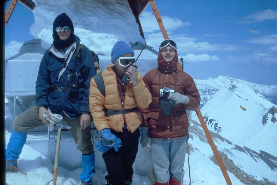 TERT members are snow in snow gear with snow all around the summit shack