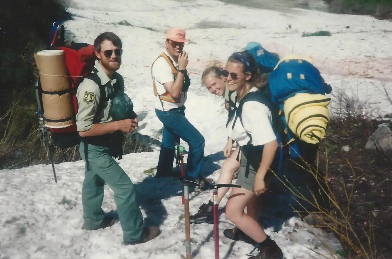 Four early members of TERT are shown with all of their gear