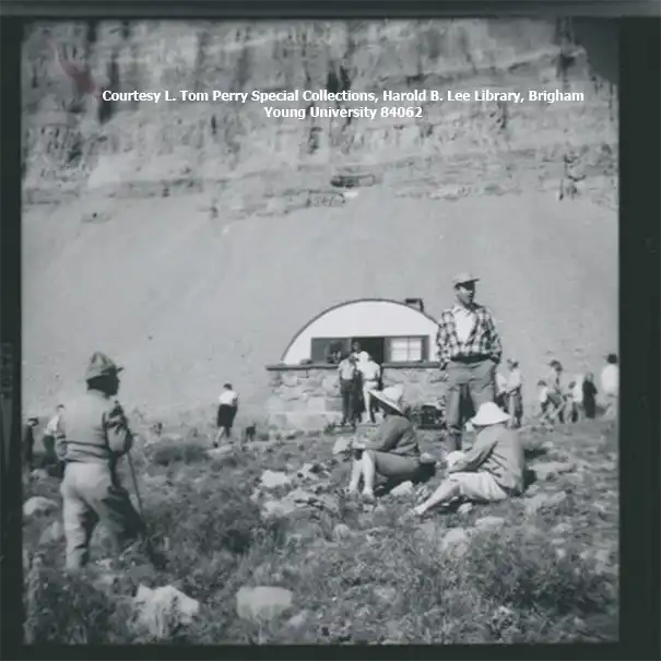 Image shows people milling around the Emerald Lake shelter