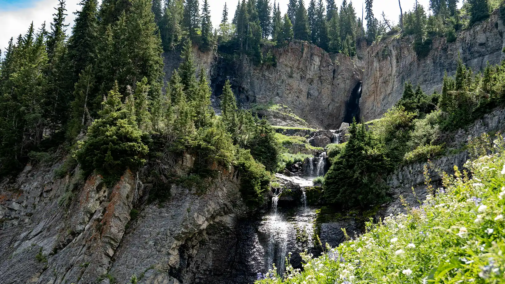 A waterfall cascades over several levels