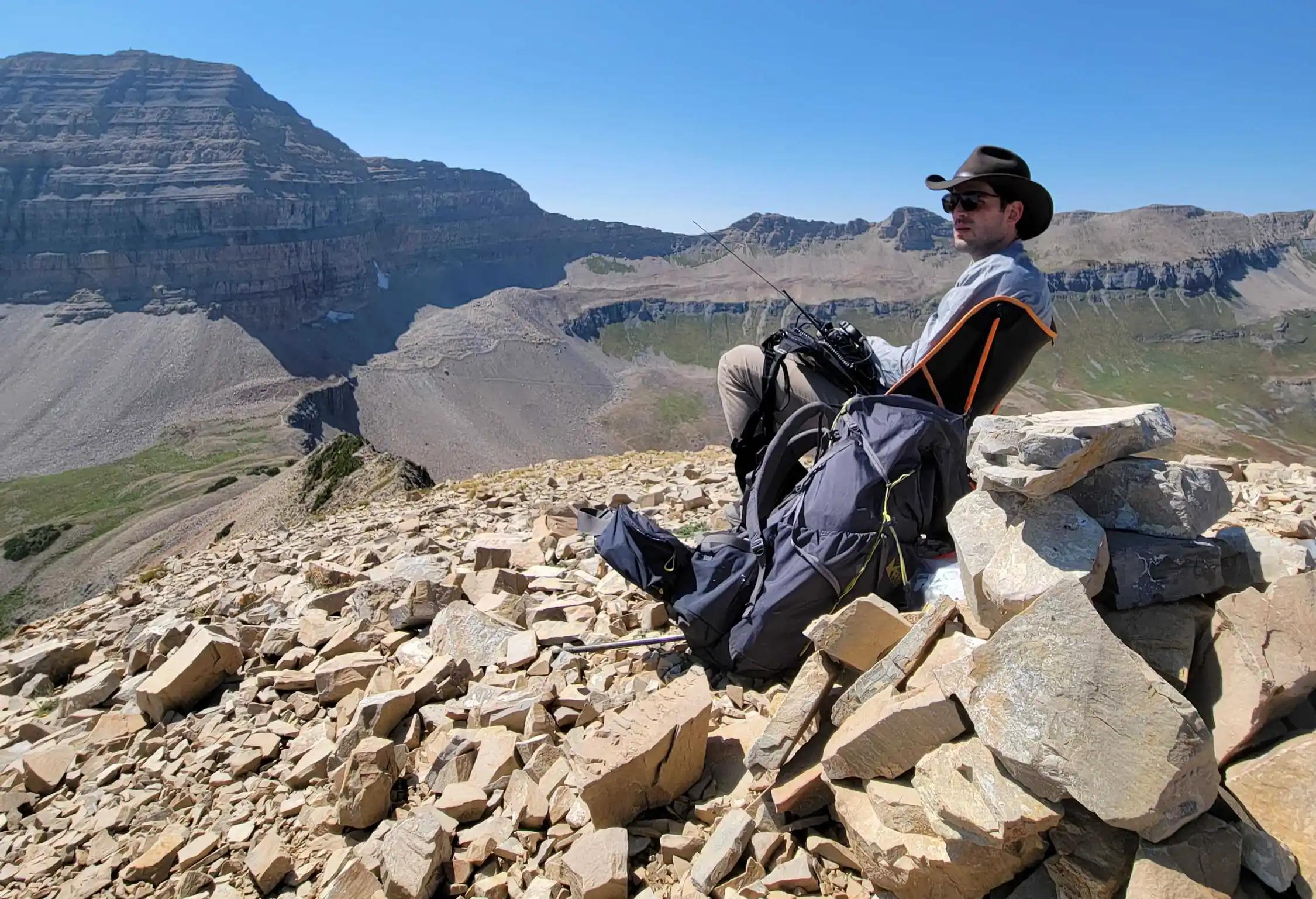 A TERT member sits in a chair at high camp