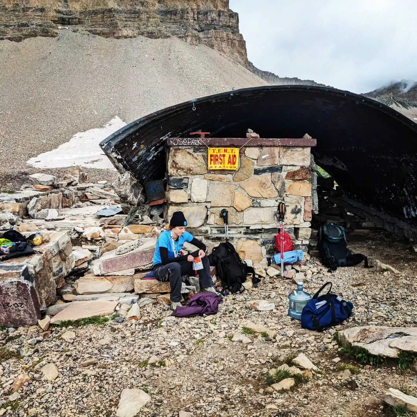 A TERT member sits in front of the broken down Emerald Lake shack