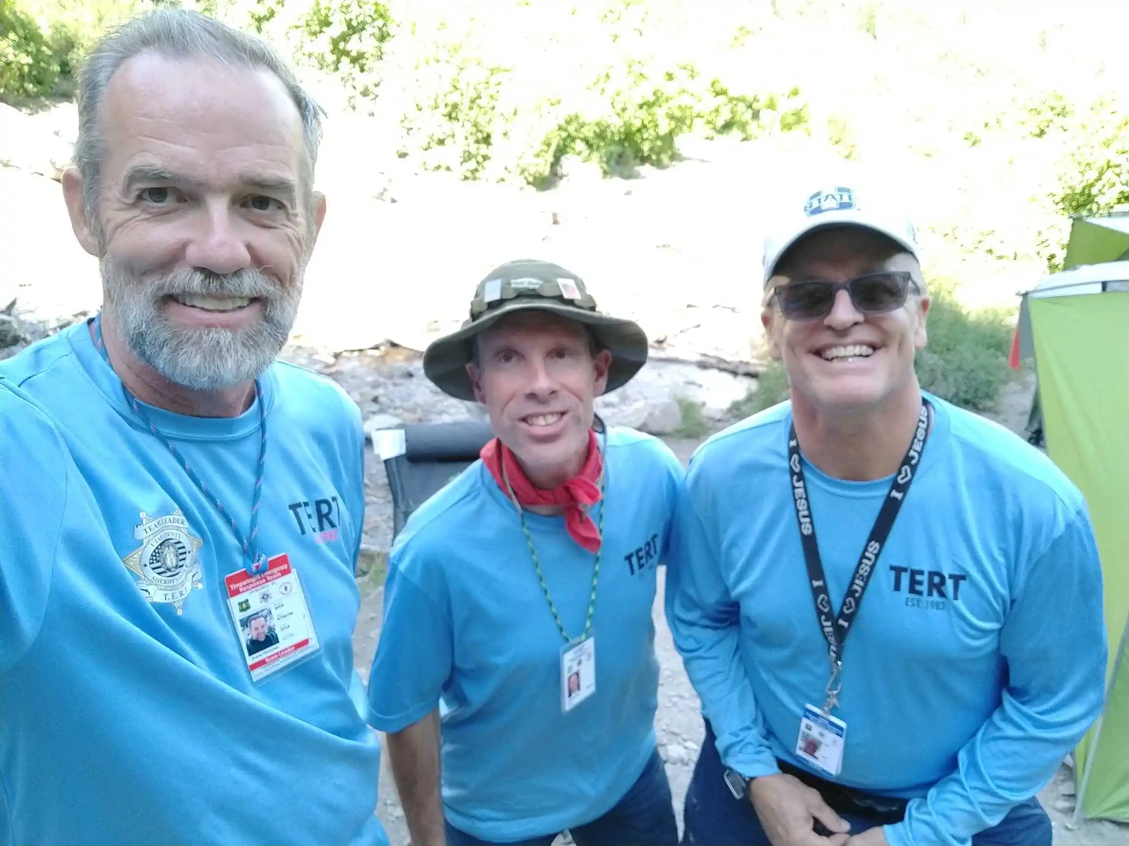 Three TERT members pose together for a selfie